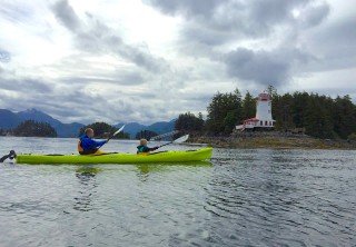 Photo of sitka kayakers near lighthouse